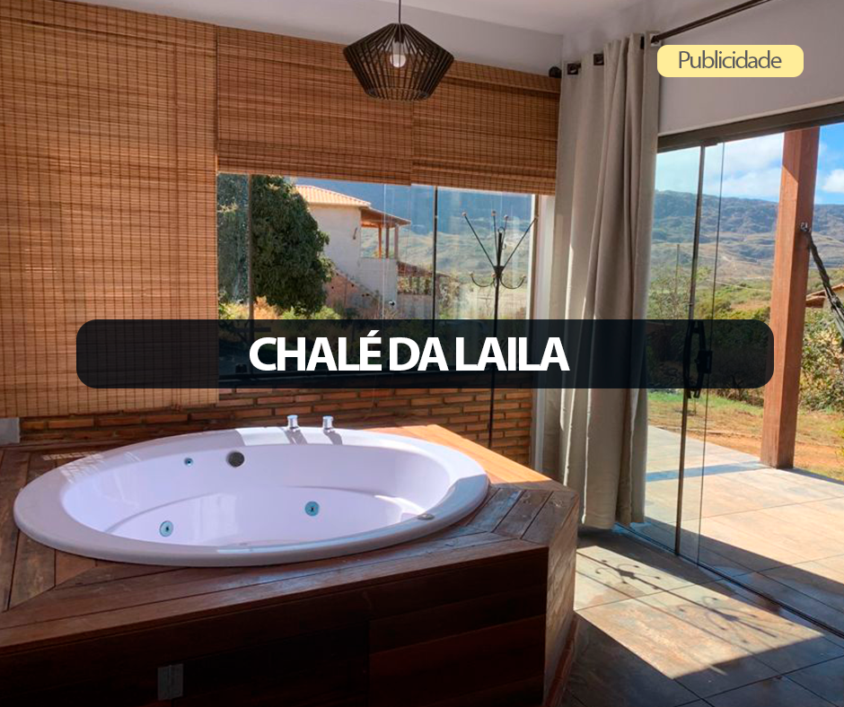 Vista panorâmica da Lapinha da Serra com montanhas da Serra do Cipó